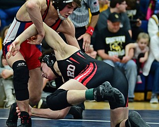 AUSTINTOWN, OHIO - FEBRUARY 3, 2018: Fitch's Gus Sutton stuffs a takedown attempt from Girard's Alex Delgarbino during their 126lb EOWL Championship bout, Saturday night at Austintown Fitch High School. DAVID DERMER | THE VINDICATOR