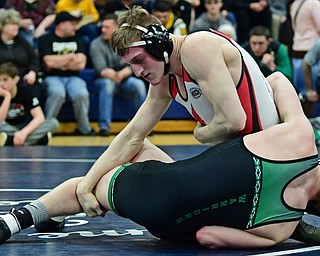 AUSTINTOWN, OHIO - FEBRUARY 3, 2018: Canfield's David Reinhart grabs the leg of West Branch's Dylan Miller during their 152lb EOWL Championship bout, Saturday night at Austintown Fitch High School. DAVID DERMER | THE VINDICATOR