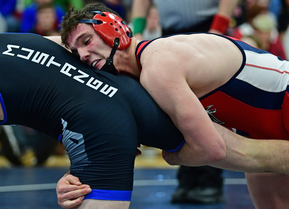 AUSTINTOWN, OHIO - FEBRUARY 3, 2018: Fitch's Michael Ferree grabs the leg of Grand Valley's Clayton Takacs during their 160lb EOWL Championship bout, Saturday night at Austintown Fitch High School. DAVID DERMER | THE VINDICATOR