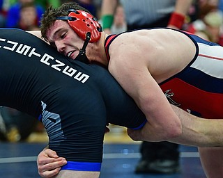 AUSTINTOWN, OHIO - FEBRUARY 3, 2018: Fitch's Michael Ferree grabs the leg of Grand Valley's Clayton Takacs during their 160lb EOWL Championship bout, Saturday night at Austintown Fitch High School. DAVID DERMER | THE VINDICATOR