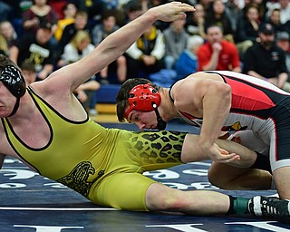 AUSTINTOWN, OHIO - FEBRUARY 3, 2018: Canfield's David Crawford takes down Liberty's Kaleb Merrick-Neff during their 182lb EOWL Championship bout, Saturday night at Austintown Fitch High School. DAVID DERMER | THE VINDICATOR