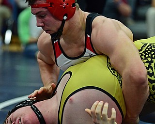 AUSTINTOWN, OHIO - FEBRUARY 3, 2018: Canfield's David Crawford attempts to pin Liberty's Kaleb Merrick-Neff during their 182lb EOWL Championship bout, Saturday night at Austintown Fitch High School. DAVID DERMER | THE VINDICATOR