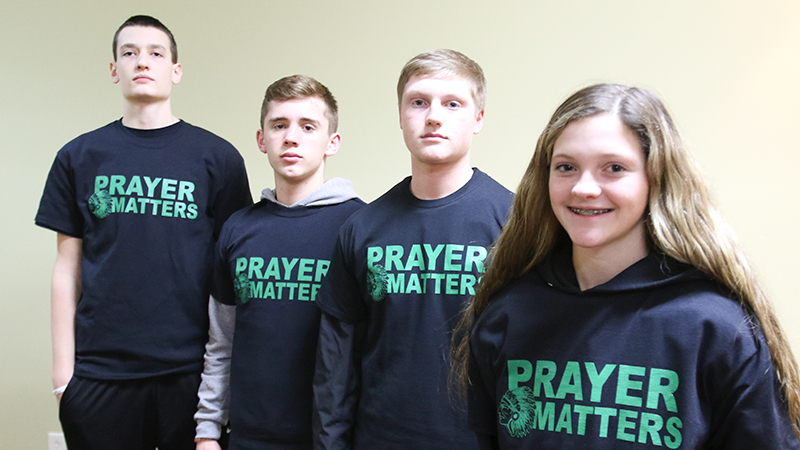 A controversy about prayer in West Branch schools has encouraged basketball
players to wear “Prayer Matters” shirts.
Pictured, from left, are sophomore varsity
players Nick Everett, Reese Leone, Nick Pidgeon and junior varsity player Jillian Pidgeon.