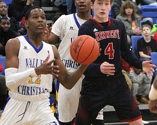 William D Lewis the Vindicator  VCS Melvin Neail(12) passes around JFk'sGianni Eaton(4).