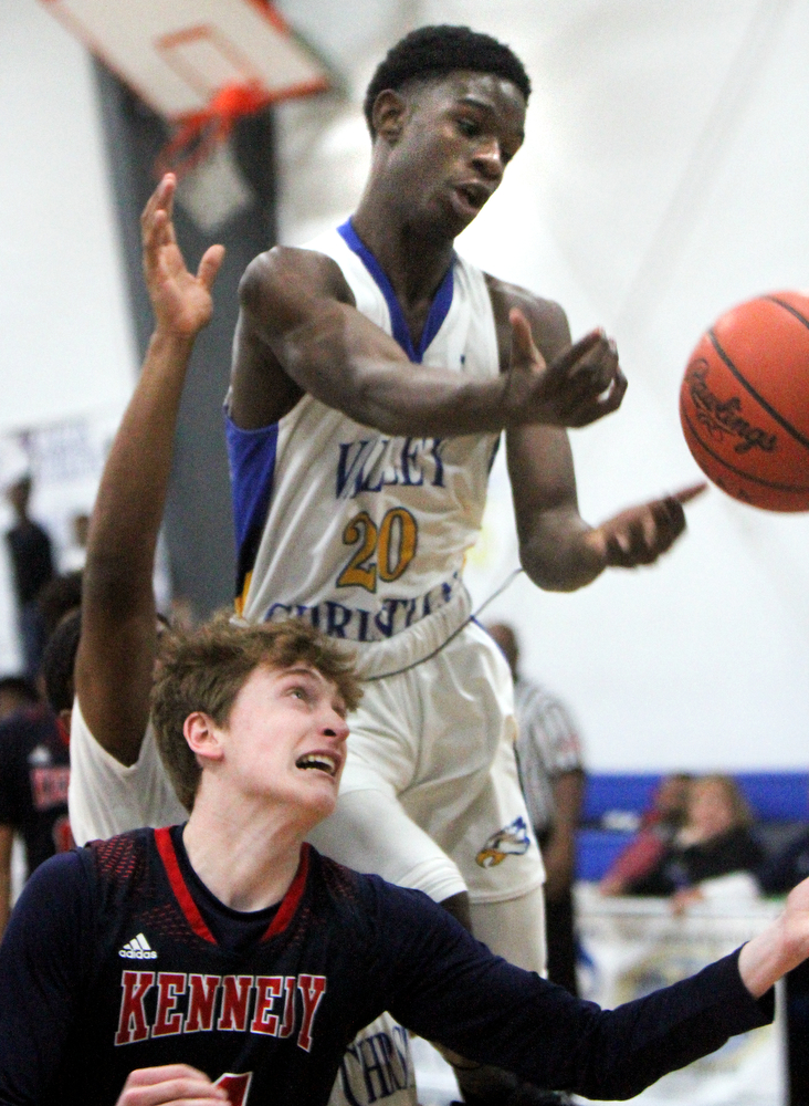 William D Lewis The Vindicator  VCS Damon Christian(20) and JFK's Gianni Eaton(4) go for a rebound.