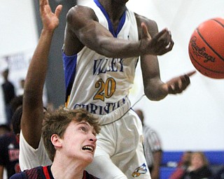 William D Lewis The Vindicator  VCS Damon Christian(20) and JFK's Gianni Eaton(4) go for a rebound.