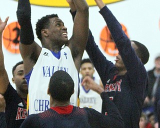 William D Lewis The Vindicator  VCS Milan Square(5) shoots over JFk's Byron Taylor(12) and Tyler James (5).