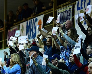 McDONALD, OHIO - FEBRYARY 6, 2018: Fans hold up 1000 point papers after Zach Rasile hit a three point shot to surpass 1000 in his career during the first half of their game on Tuesday night at McDonald High School. DAVID DERMER | THE VINDICATOR