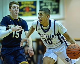 McDONALD, OHIO - FEBRUARY 6, 2018: McDonald's Braedon Poole drives on Lowellville's Jake Rotz during the first half of their game on Tuesday night at McDonald High School. DAVID DERMER | THE VINDICATOR