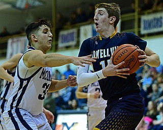 McDONALD, OHIO - FEBRUARY 6, 2018: Lowellville's Jake Rotzdrives on McDonald's Matthew Beedle during the second half of their game on Tuesday night at McDonald High School. DAVID DERMER | THE VINDICATOR