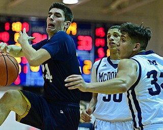 McDONALD, OHIO - FEBRUARY 6, 2018: Lowellville's Joe Ballone loses control of the ball while being pressured by McDonald's Matthew Beedle and Braedon Poole during the second half of their game on Tuesday night at McDonald High School. DAVID DERMER | THE VINDICATOR