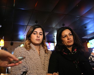 Fidaa Musleh(right) talks to the media with daughter Lina Adi, Wednesday, Feb. 7, 2018, at the Downtown Circle Convenience and Deli in Youngstown. ..(Nikos Frazier | The Vindicator)