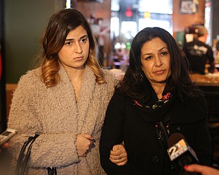 Fidaa Musleh(right) talks to the media with daughter Lina Adi, Wednesday, Feb. 7, 2018, at the Downtown Circle Convenience and Deli in Youngstown. ..(Nikos Frazier | The Vindicator)