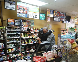 Fidaa Musleh hugs XXXX goodbye before departing for Cleveland Hopkins International Airport, Wednesday, Feb. 7, 2018, at the Downtown Circle Convenience and Deli in Youngstown. ..(Nikos Frazier | The Vindicator)