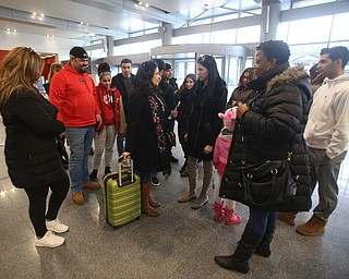 Fidaa Musleh says goodbye to her family, Wednesday, Feb. 7, 2018, at Cleveland Hopkins International Airport in Cleveland. ..(Nikos Frazier | The Vindicator)