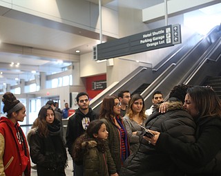 Fidaa Mushleh(back) hugs Ithica Brown goodbye before departing for her flight to reunite with her husband, Al Adi in Amman, Jordan, Wednesday, Feb. 7, 2018, at Cleveland Hopkins International Airport in Cleveland. Adi was deported to Jordan last week after 13 days in ICE detainment...(Nikos Frazier | The Vindicator)