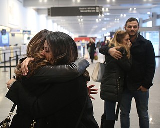 Fidaa Mushleh(back) hugs Gina Musleh goodbye before departing for her flight to reunite with her husband, Al Adi in Amman, Jordan, Wednesday, Feb. 7, 2018, at Cleveland Hopkins International Airport in Cleveland. Adi was deported to Jordan last week after 13 days in ICE detainment...(Nikos Frazier | The Vindicator)