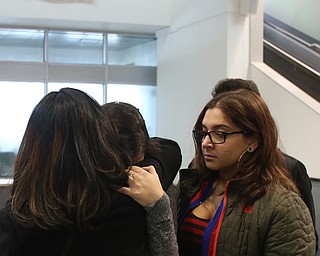 Fidaa Musleh(left) hugs her daughters, Lina(center) Adi goodbye before departing for her flight to reunite with her husband, Al Adi in Amman, Jordan, Wednesday, Feb. 7, 2018, at Cleveland Hopkins International Airport in Cleveland. Adi was deported to Jordan last week after 13 days in ICE detainment...(Nikos Frazier | The Vindicator)