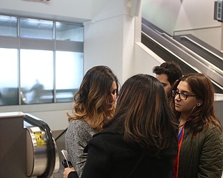 Fidaa Musleh(left) hugs her daughters, Lina(center) and Rania Adi goodbye before departing for her flight to reunite with her husband, Al Adi in Amman, Jordan, Wednesday, Feb. 7, 2018, at Cleveland Hopkins International Airport in Cleveland. Adi was deported to Jordan last week after 13 days in ICE detainment...(Nikos Frazier | The Vindicator)