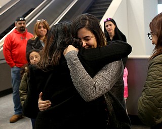 Fidaa Musleh(left) hugs her daughter, Lina Adi goodbye before departing for her flight to reunite with her husband, Al Adi in Amman, Jordan, Wednesday, Feb. 7, 2018, at Cleveland Hopkins International Airport in Cleveland. Adi was deported to Jordan last week after 13 days in ICE detainment...(Nikos Frazier | The Vindicator)