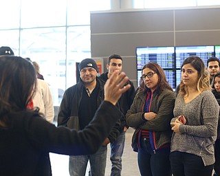 Fidaa Musleh waves goodbye to her daughters Rania and Lina Adi and family before departing for her flight to reunite with her husband, Al Adi in Amman, Jordan, Wednesday, Feb. 7, 2018, at Cleveland Hopkins International Airport in Cleveland. Adi was deported to Jordan last week after 13 days in ICE detainment...(Nikos Frazier | The Vindicator)