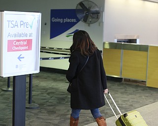 Fidaa Adi enters the TSA Security Checkpoint to board a flight to reunite with her husband Al Adi, Wednesday, Feb. 7, 2018, at Cleveland Hopkins International Airport in Cleveland. ..(Nikos Frazier | The Vindicator)