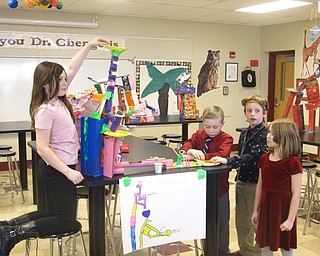 Neighbors | Zack Shively.Second grade students at Stadium Drive Elementary constructed contraptions during their Force and Motion unit to demonstrate their understanding of the basic physics learned through the lesson. Pictured, clockwise from left, are Mia Martin, Mitchell Evans, Logan Miller and Calli Walker.