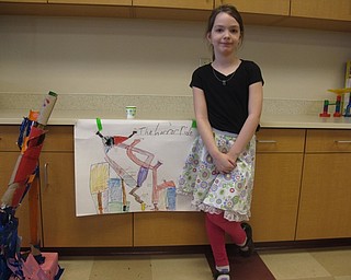 Neighbors | Zack Shively.The Stadium Drive Elementary teachers Brittany Krestel and Jessica Koehler sorted the class into groups of four and gave each group a leader. Pictured is a group leader Kaylee Bushling next to her poster for her force and motion project, "The Horror Ride."