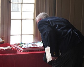 Neighbors | Zack Shively.The Poland Historical Society provided hot chocolate and cake for McKinley's birthday celebration. Those who attended the event sang happy birthday and Paul McQueen blew out the candles on the cake.