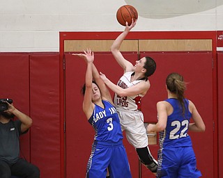 Columbiana's Taylor Hall (23) goes up for a layup on top of Jackson-Milton guard Emily Williams (3) in the third quarter of an OHSAA high school basketball game, Thursday, Feb. 8, 2018, in Columbiana. Columbiana won 36-23...(Nikos Frazier | The Vindicator)