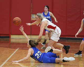 Jackson-Milton guard Michaelina Terranova (22) and Columbiana's Tessa Liggett (5) jump out for the loose ball in the fourth quarter of an OHSAA high school basketball game, Thursday, Feb. 8, 2018, in Columbiana. Columbiana won 36-23...(Nikos Frazier | The Vindicator)