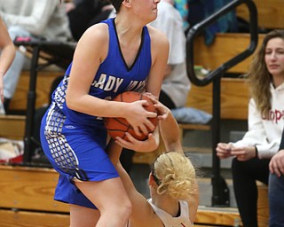 Jackson-Milton forward Abigail Spalding (40) strips the ball from Columbiana's Alexis Cross (20) in the fourth quarter of an OHSAA high school basketball game, Thursday, Feb. 8, 2018, in Columbiana. Columbiana won 36-23...(Nikos Frazier | The Vindicator)