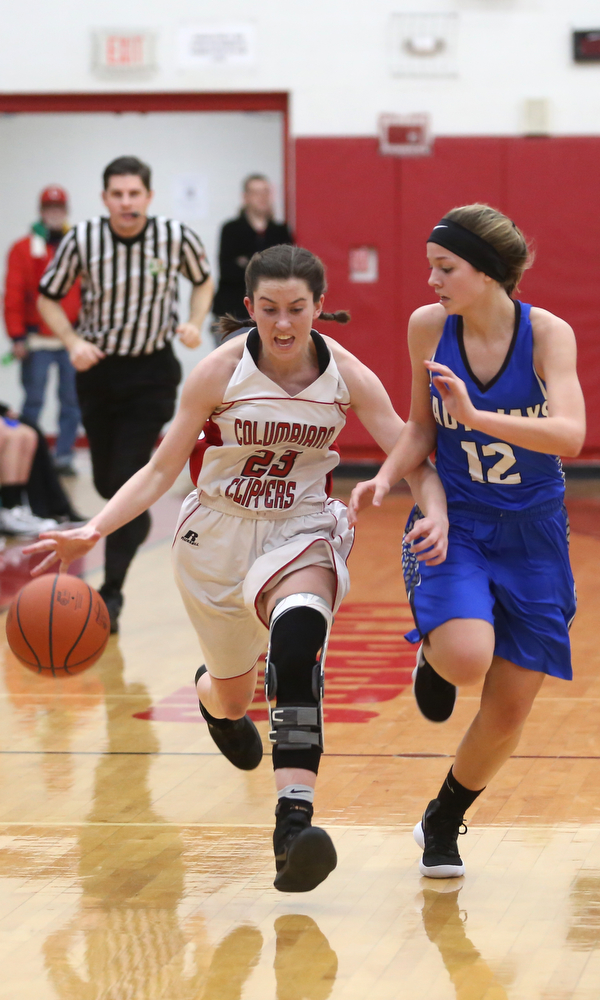 Columbiana's Taylor Hall (23) charges past Jackson-Milton guard Courtney Mercer (12) in the fourth quarter of an OHSAA high school basketball game, Thursday, Feb. 8, 2018, in Columbiana. Columbiana won 36-23...(Nikos Frazier | The Vindicator)