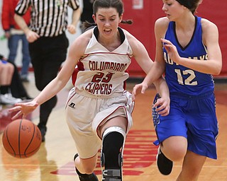 Columbiana's Taylor Hall (23) charges past Jackson-Milton guard Courtney Mercer (12) in the fourth quarter of an OHSAA high school basketball game, Thursday, Feb. 8, 2018, in Columbiana. Columbiana won 36-23...(Nikos Frazier | The Vindicator)