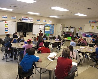 Neighbors | Zack Shively.Austintown Intermediate School invited community members and school staff to read in the classrooms in the school throughout the day. Pictured, Laura Howard read to her son's class.