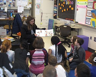 Neighbors | Zack Shively.Michael Sauners, principal of Austintown Intermediate School, said that the day showed the connection between the community and the school. Pictured, Lori Scott read "Bad Guy" by Hannah Barnaby to Mr. Rhodes class.