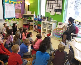 Neighbors | Zack Shively.The parents received slips from the Austintown Intermediate School teachers asking them if they wanted to read to the class. Pictured, Sarah Fenton read Kobi Yamada's "What to Do with a Problem."