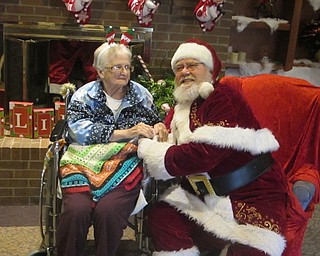 Neighbors | Zack Shively.Beeghly Oaks invited Santa to their Christmas party. He met with the residents, and the staff took photos.