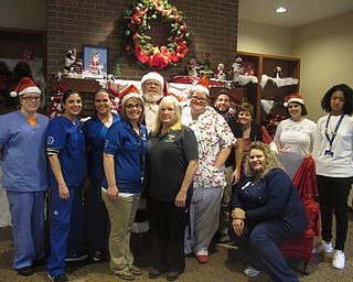 Neighbors | Zack Shively.The Beeghly Oaks staff wanted to give their residents a fun party for Christmas. Pictured is some of the staff from the Christmas celebration with Santa.