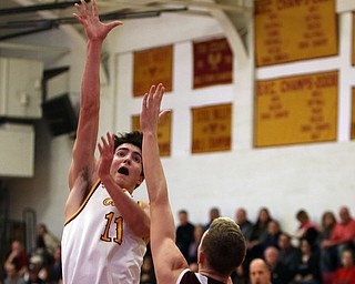             ROBERT  K. YOSAY | THE VINDICATOR..Boardmn at Cardinal Mooney ..Mooney #11 Anthony Fire up and over   #3 Holden Lipke during first quarter action at Mooney