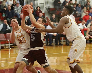             ROBERT  K. YOSAY | THE VINDICATOR..Boardmn at Cardinal Mooney ..Driving Hard #5 Boardman Mike Melewski  drives as defese from Mooney#33  Johnny Murphy and #0 Terrell Brown