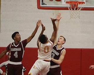             ROBERT  K. YOSAY | THE VINDICATOR..Boardmn at Cardinal Mooney .Mooney #0 Terrel Brown gets blocked by #4 Boardman Mark Phillips and #3 Sonny Rodriquez during second quarter action at mooney