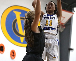 Valley Christian's Imane Snyder (11) goes up over Garfield's Emma Trent (12) for two in the third quarter of an OHSAA high school basketball game, Saturday, Feb. 10, 2018, in Youngstown. Garfield won 64-58...(Nikos Frazier | The Vindicator)