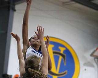 Valley Christian's Imane Snyder (11) goes up for a layup over Garfield's Emma Trent (12) in the fourth quarter of an OHSAA high school basketball game, Saturday, Feb. 10, 2018, in Youngstown. Garfield won 64-58...(Nikos Frazier | The Vindicator)