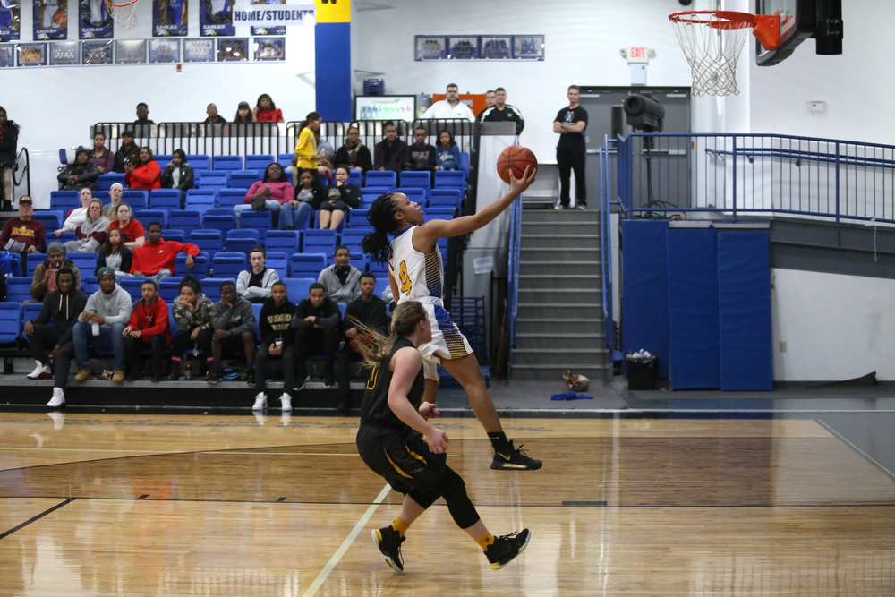 Valley Christian's Kristen Gill (4) goes up for a layup in the fourth quarter of an OHSAA high school basketball game, Saturday, Feb. 10, 2018, in Youngstown. Garfield won 64-58...(Nikos Frazier | The Vindicator)