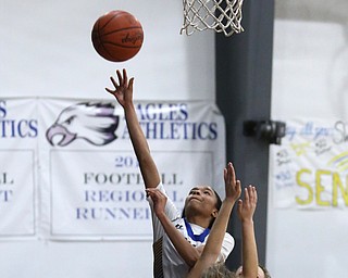 Valley Christian's India Snyder (2) goes up for a layup over Garfield's Emma Trent (12) in the fourth quarter of an OHSAA high school basketball game, Saturday, Feb. 10, 2018, in Youngstown. Garfield won 64-58...(Nikos Frazier | The Vindicator)