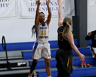 Valley Christian's Imane Snyder (11) goes up for three over Garfield's Kiley Carey (20) in the fourth quarter of an OHSAA high school basketball game, Saturday, Feb. 10, 2018, in Youngstown. Garfield won 64-58...(Nikos Frazier | The Vindicator)