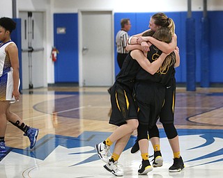 Garfield players celebrate after defeating Valley Christian 64-58, Saturday, Feb. 10, 2018, in Youngstown...(Nikos Frazier | The Vindicator)