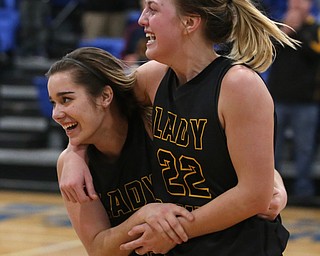 Garfield's Ashlun Geddes (4) and Garfield's Makenna Lawrence (22) celebrate after defeating Valley Christian 64-58, Saturday, Feb. 10, 2018, in Youngstown...(Nikos Frazier | The Vindicator)