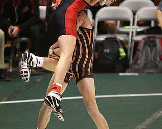 Claymont 113 pound wrestler Jarrett Warrington picks up and throws Canfield 113 pound wrestler Ronald Angelilli in the quarter finals of the OHSAA State Wrestling Dual Team Tournament, Sunday, Feb. 11, 2018, at Ohio State University's St. John Arena in Columbus...(Nikos Frazier | The Vindicator)